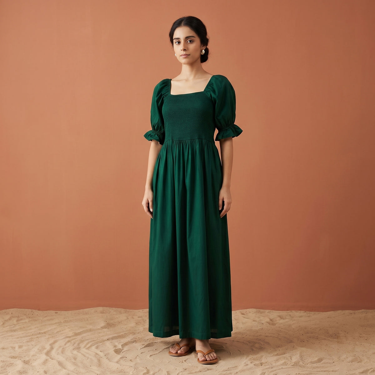Bottle green maxi dress with a smocked bodice, square neck and puffed elbow sleeves